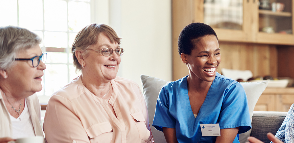 Healthcare professionals and service users having a discussion.